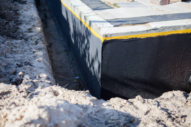 Professional Waterproofing technician working in Genoa, OH